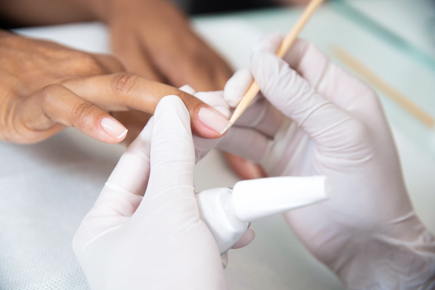 A BIAB manicure being applied to natural nails