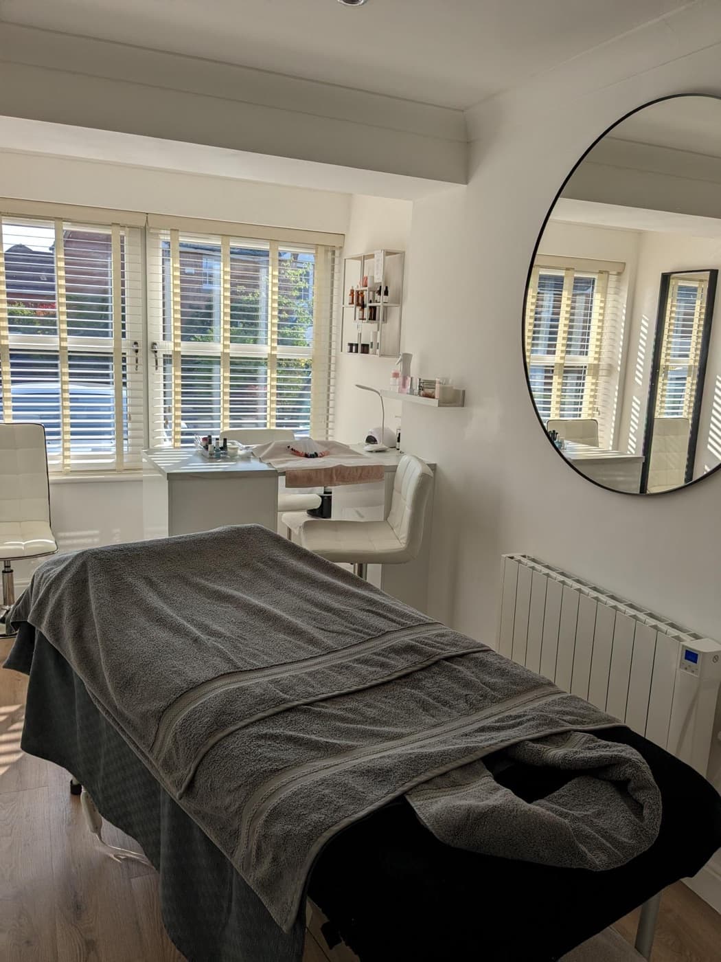 Aura's treatment couch prepared for a massage and facial combination