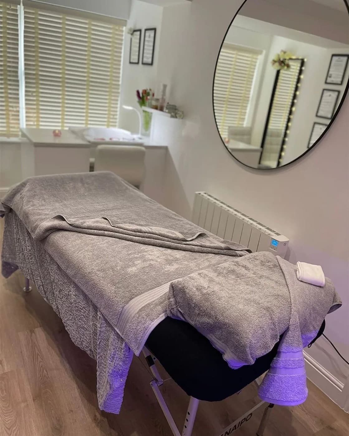 The treatment couch prepared for a facial at Aura